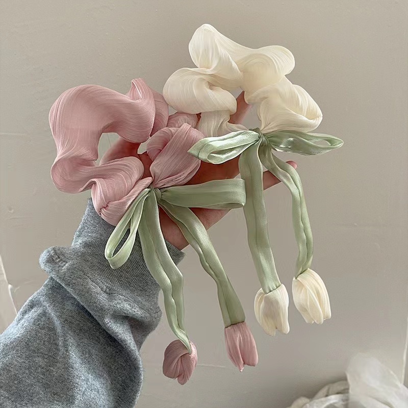 Sono previsti sconti per l'acquisto sfuso di elastici per capelli con fiocco di fiori di tulipano?